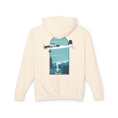Aviation Hoodie in beige with Cessna 180 flying over blue waterfall. Pilot Apparel 